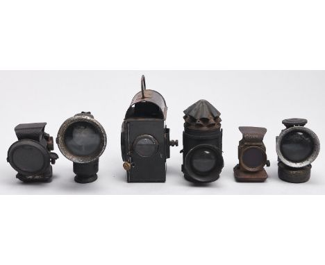 Four early 20th c Lucas and other cycle lamps and two hand lanterns, one with oval embossed badge G/Crown/R 1943/SNLW Ltd (6)