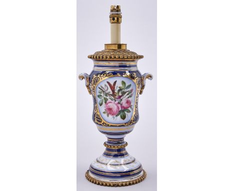 A French gilt lacquered, brass mounted cobalt ground porcelain oil lamp, c1880, slightly waisted ogee shape, painted with a b