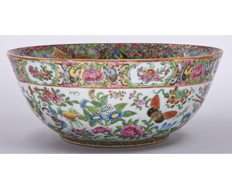 A Canton famille rose bowl, second half 19th c, typically decorated with birds, insects, peaches and flowers between richly p
