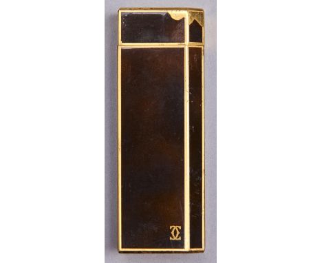 A Cartier gold plated and faux tortoiseshell cigarette lighter, No G78017  Light wear scratches from occasional normal use co