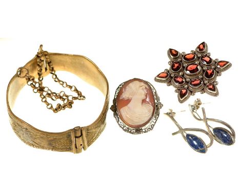 A garnet set silver star brooch, Nepal, late 20th c, a pair of sodalite earrings in silver, a cameo brooch and an engraved gi