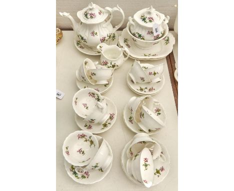 A Coalport bone china tea service, c1840,&nbsp; printed and painted in pink and green with scattered flowers, the service inc