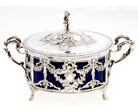 A French oval silver openwork butter dish and cover, c1900, the domed cover with putto finial, the dish embossed with ribbon 