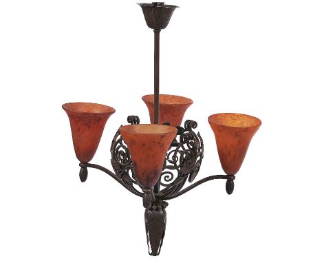 An art deco wrought iron hanging light, Belgian or French, c1930, the four mottled orange glass lampshades attributed to&nbsp