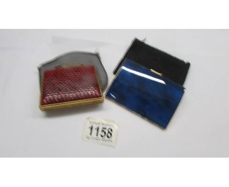 A handbag mirror in the form of a handbag and a vintage cigarette case.