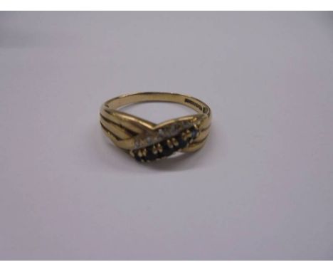 A sapphire and diamond gold ring, size N, 1.7 grams.