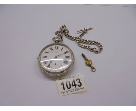 A silver pocket watch, John Jenkinson 40425 on silver Albert chain with key, in working order.