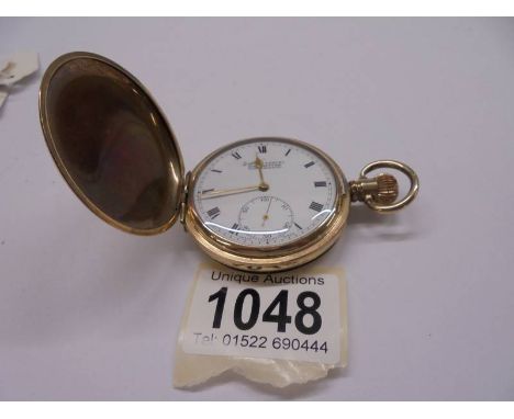 A Dennison gold plated full hunter pocket watch, in working order.In Working Order, Plated finish in good condition 