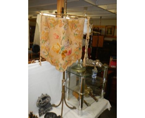 A brass pole screen with tapestry banner. COLLECT ONLY.