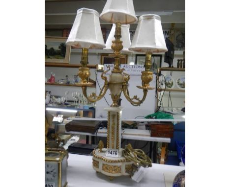 A French ormolu and alabaster four lamp table light,