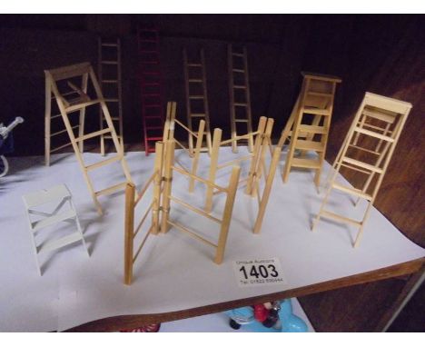 A quantity of doll house ladders, step ladders and clothes airers.