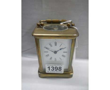 A brass carriage clock.