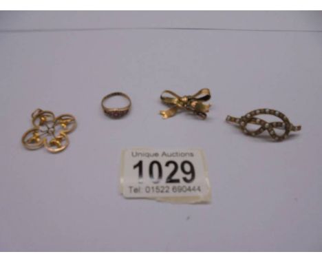 A 9ct gold bow brooch 2.1g, a 9ct gold ring 1.3g (missing 1 stone), a yellow metal brooch set seed pearls and a yellow metal 