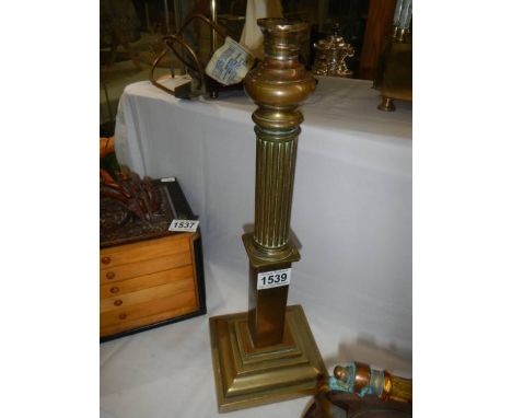 A brass oil lamp base.