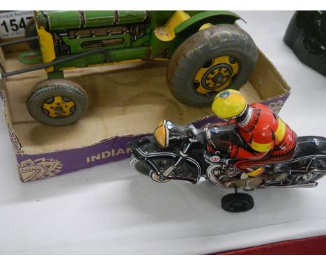A Mettoy tin plate tractor a/f and a West German tin plate motorcycle.