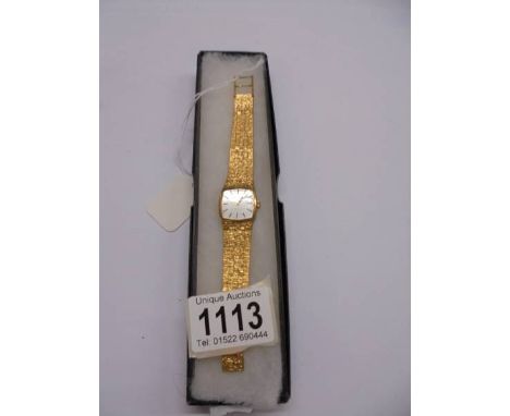 A vintage yellow metal Bulova mechanical wrist watch.