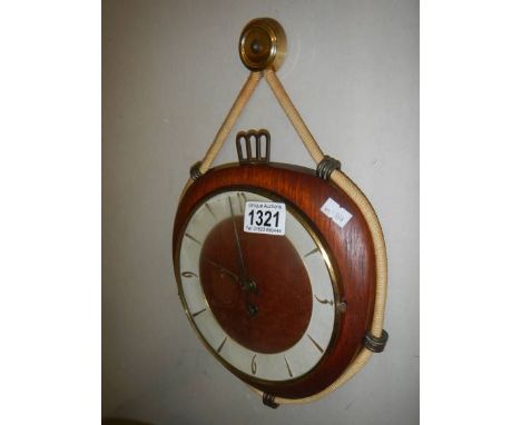 A vintage Kienzle wall clock with key.