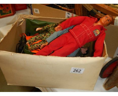 A box of vintage Action Man dolls, Six Million Dollar man and accessories.