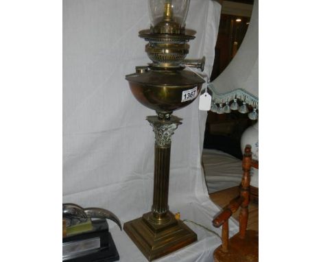 A brass Corinthian column oil lamp with chimney. COLLECT ONLY.