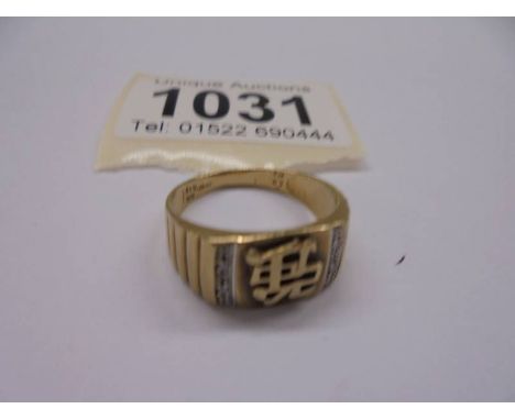 A 9ct gold ring with Chinese symbol, size Q, 3.7 grams.