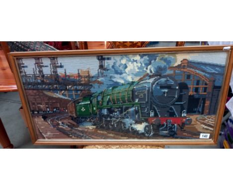 A framed and glazed tapestry of a steam engine 92220 Evening Star leaving Paddington COLLECT ONLY
