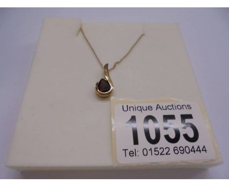 A 9ct gold pendant set red stone, marked 375.&nbsp; 1.5 grams.