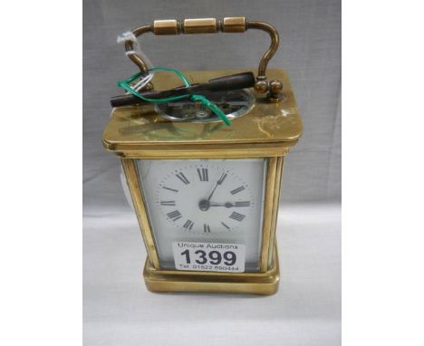 A brass carriage clock.