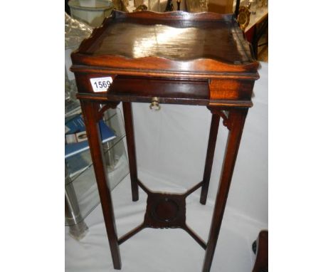 A Victorian mahogany lamp table. COLLECT ONLY.