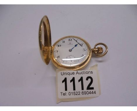 A 9ct gold Omega full hunter pocket watch (working but one hand loose). 69.3gms