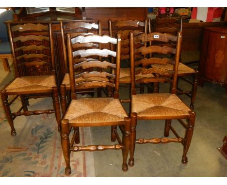 A set of six oak ladder back chairs. COLLECT ONLY.