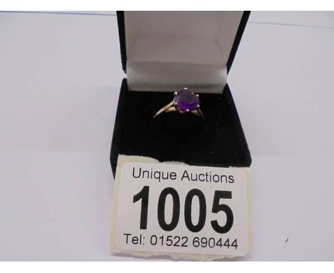 An American 10ct gold amethyst ring, size L, 1.78 grams.