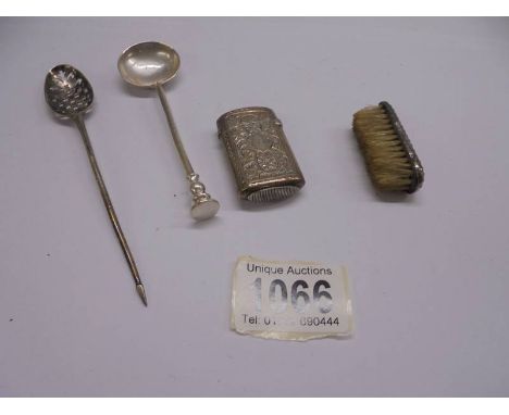A silver monogrammed vesta case, a silver moustache brush, a small silver ladle and another spoon, marks indistinct.