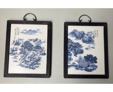 CHINESE WALL PLAQUES, a pair, blue/white ceramic, framed, 29cm x 37cm. (2) 