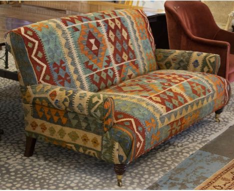 SOFA, 18mc H x 176cm, Kilim upholstered with brass front castors. 