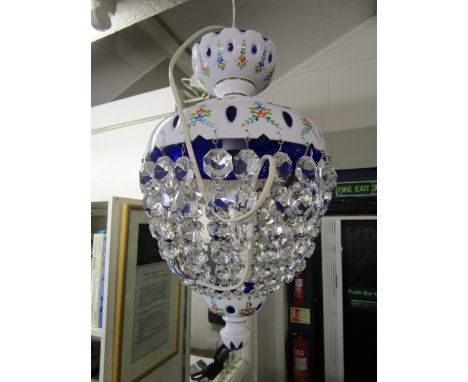 A Bohemian painted opal overlaid and blue glass ceiling light with faceted glass lustres and two gilt metal and faceted glass