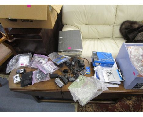 A selection of digital cameras to include a Vivitar 4000, 6.3 mega pixel, series 1, various camera manuals and assorted  acce