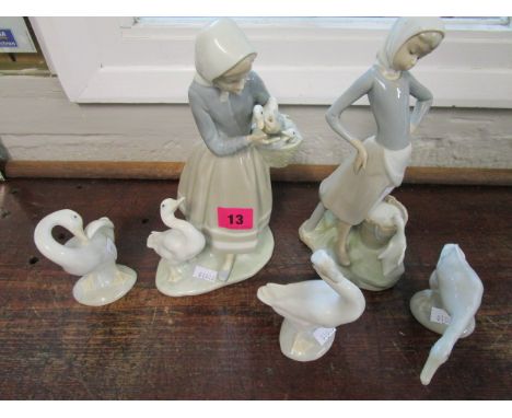 A group of Lladro figurines and models to include a goose girl with a goose drinking from a pail (5) 