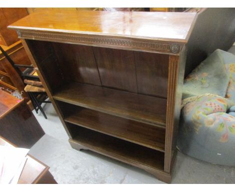Circa 1900 a mahogany bookcase, with Greek key ornament, fitted with three shelves with fluted columns, on bracket feet, , 45