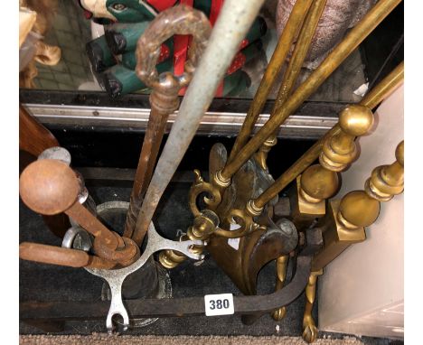 PAIR OF BRASS AND IRONS AND FIRE TOOLS