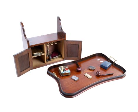 A mahogany inlaid tray and a smokers' cabinet with pipes. The tray of serpentine form raised gallery and brass handles, cabin