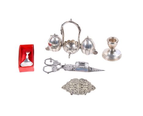 An assortment of silver and silver-plate. Including a silver caddy spoon, 19.7g, a weighted silver dwarf candlestick, H6cm, a