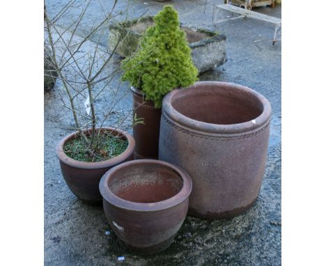 A group of four assorted ceramic garden planters. Including two with plants. Max. H53cm
