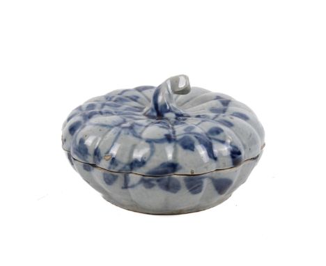 A shallow ceramic pumpkin box and cover. Painted blue floral decoration and a four section brown treacle glaze interior. Diam
