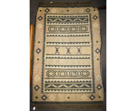 A vintage Kilim woollen rug. Geometric patterns in brown and beige. 180cm x 123cm
