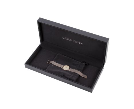 A ladies silver Georg Jensen wristwatch and an empty George Jensen box. The watch having a silvered dial with dot hour marks,
