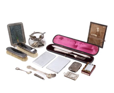 A small collection of silver and silver-plated table items and a lighter. Including a silver photograph frame, two silver mou
