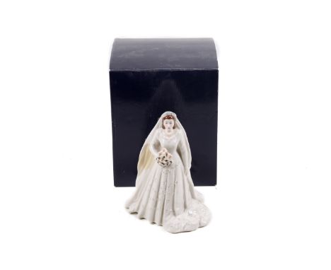 A Royal Worcester figure of Elizabeth II in her wedding dress. From 2007, celebrating her Diamond Anniversary, H23cm, in the 