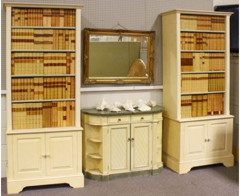 A pair of large modern antique library effect bookcases with cupboards below, the cupboard doors with faux frontage of antiqu