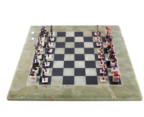 A 'Waterloo' theme diecast chess set and an onyx chess board. 'King' H11.5cm, board 65cm x 65cm