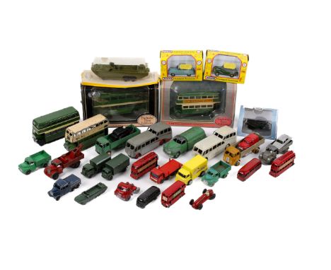 An assortment of vintage diecast vehicles. Including two boxed EFE buses, Dinky green petrol tanker, a Matchbox London Trolle